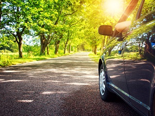 image of car driving down a rural road in Louisiana